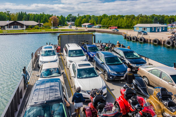 Ellison Bay, USA - Aug 11, 2017: Ferry ship leaving Washington Island and heading to Northport Pier. The Washington Island ferry ship line is the only public transportation between the Wisconsin's Door County peninula and Washington Island. The ferry company operates 4 ferry ships and each ship can carry 150 passengers and 18-21 autos.